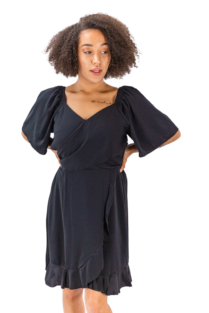 Elegance Unveiled: Black Dress with Tie Back and Ruffle Hem