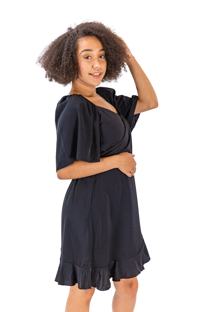 Elegance Unveiled: Black Dress with Tie Back and Ruffle Hem