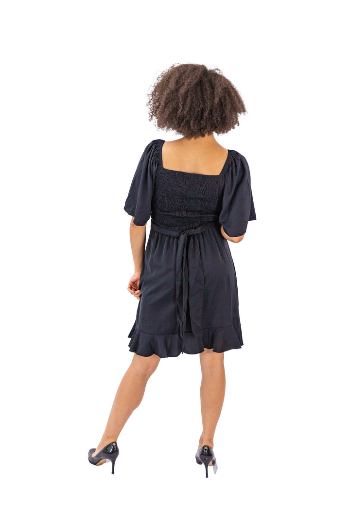 Elegance Unveiled: Black Dress with Tie Back and Ruffle Hem