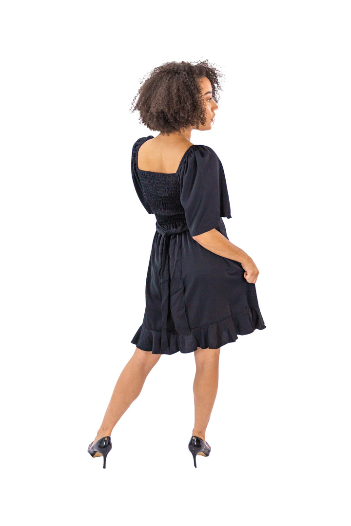 Elegance Unveiled: Black Dress with Tie Back and Ruffle Hem