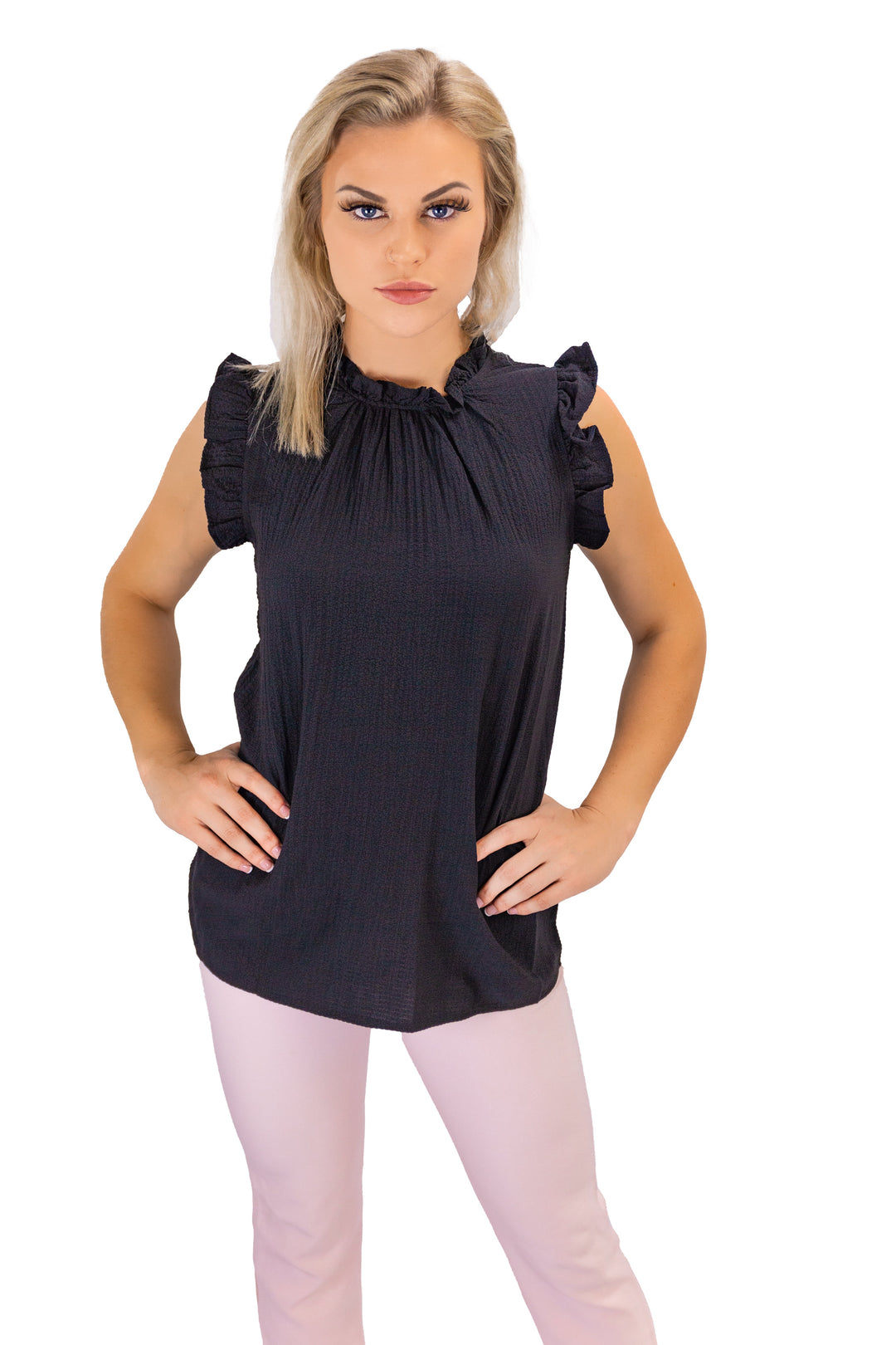 Sophisticated woman in Fabonics Black Ruffled Pullover, exemplifying casual elegance with a modern twist.